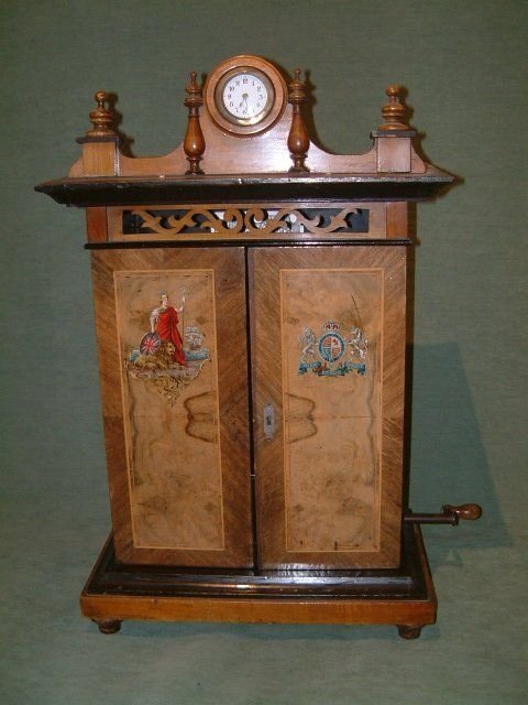 edwardian walnut britania 9 disc music box with transfer door panels