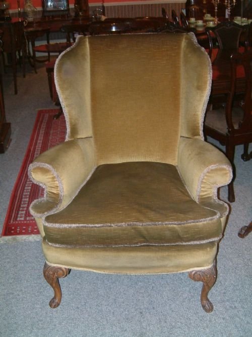 1920s queen anne style wing chair with carved cabriole legs