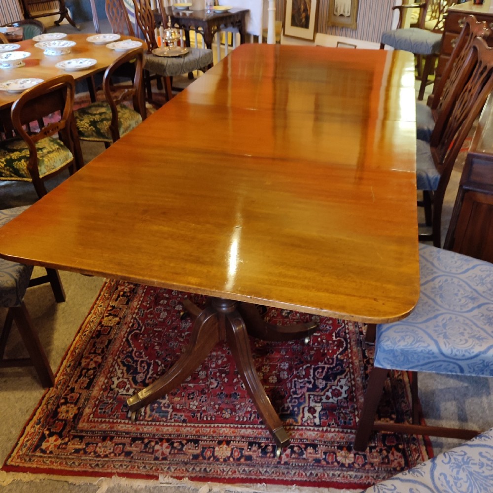 regency period mahogany double pedestal dining table with two leaves